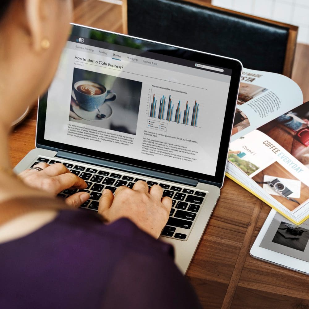 Local vs. Global SEO Require Different Strategies. A woman utilizing a laptop for local search engine optimization.