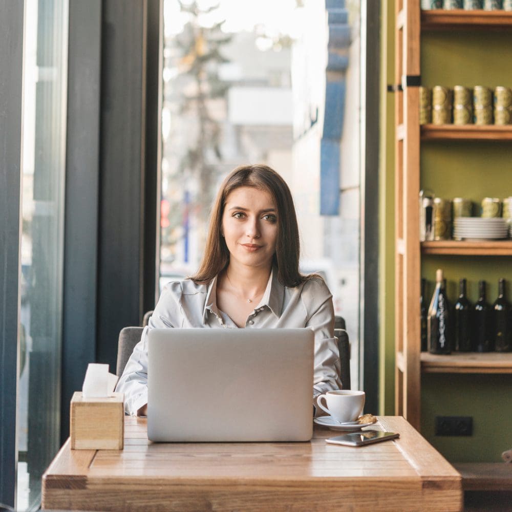 Incorporating digital marketing into your business strategy is crucial in today's world. Woman, laptop.