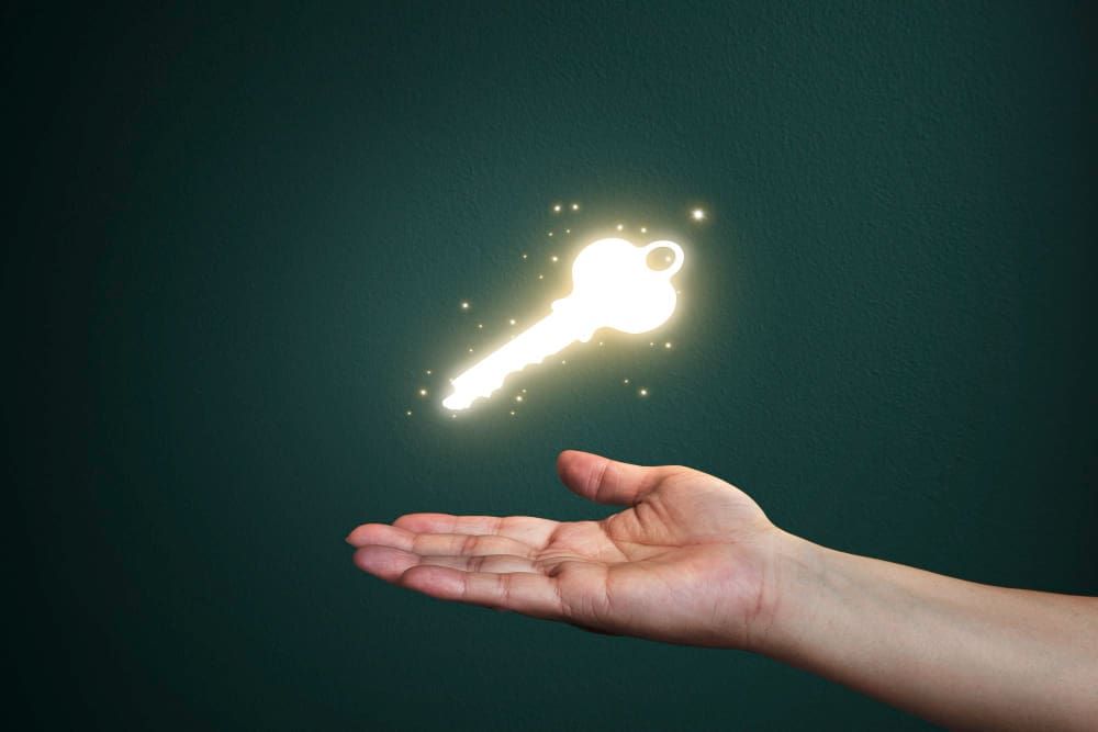 Key Benefits of Local SEO for Small Businesses A glowing key in a person's hand.