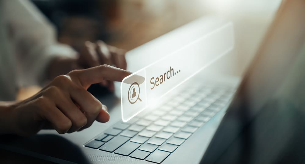 SEO can take your online presence to the next level and reach new heights of success. person, typing, laptop, word search